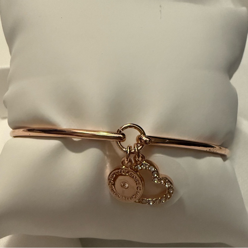 Michael Kors rose gold bangle with heart and circle charms